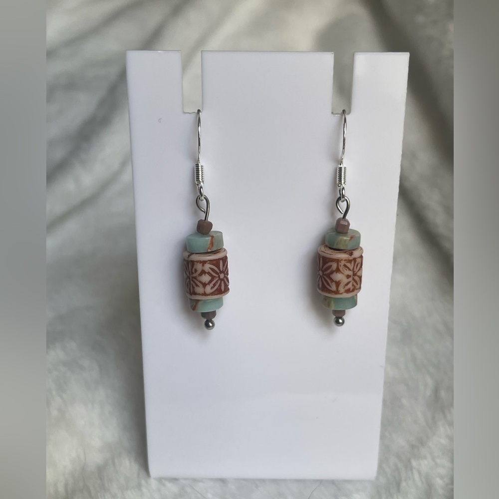 Handcrafted earrings with daisy accents and tribal vibes. 925 silver hooks.